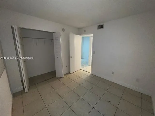 a bathroom with a sink vanity and a mirror