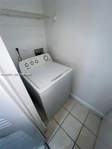 a bath tub sitting next to a white sink
