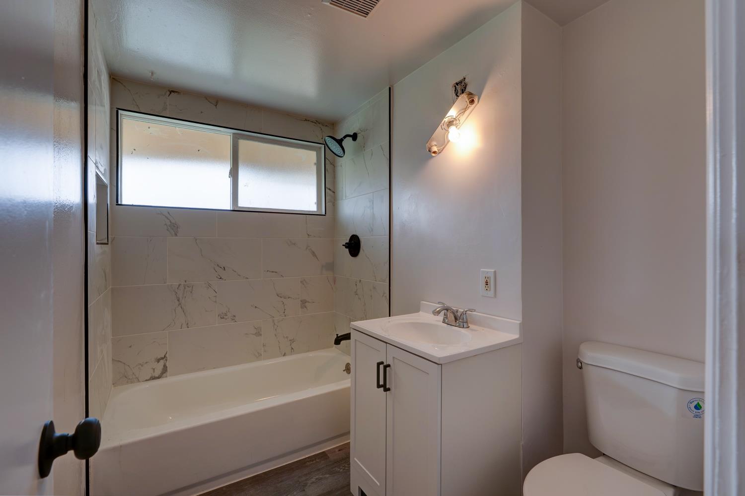 2310 Linden Street Atwater, CA 95301 - Photo 18 of 32 a bathroom with a sink toilet and shower