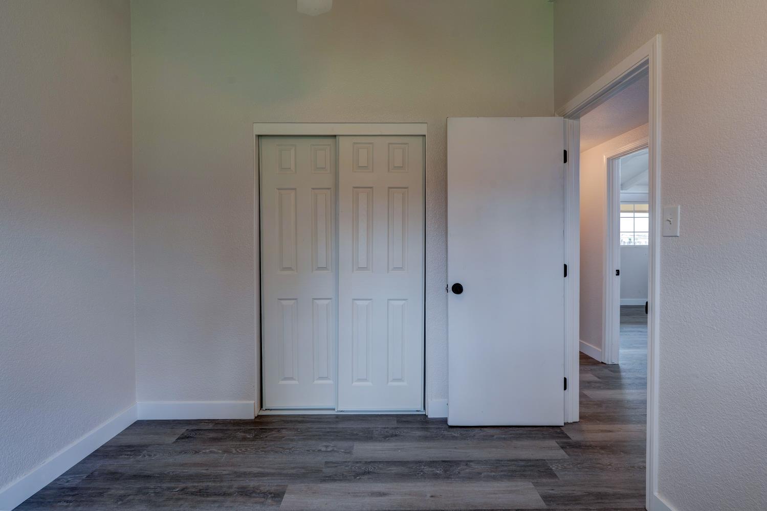 2310 Linden Street Atwater, CA 95301 - Photo 28 of 32 a view of an empty room with wooden floor