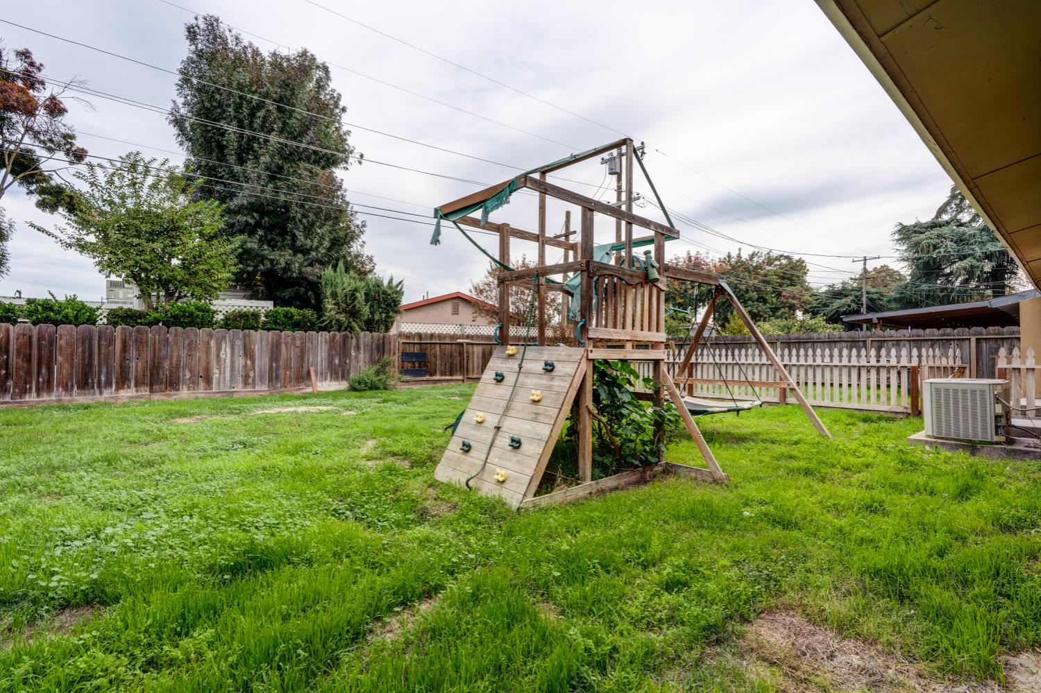 2310 Linden Street Atwater, CA 95301 - Photo 3 of 32 a view of a garden with a slide