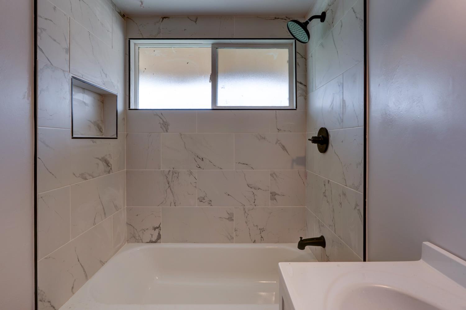 2310 Linden Street Atwater, CA 95301 - Photo 31 of 32 a bathroom with a bathtub and shower