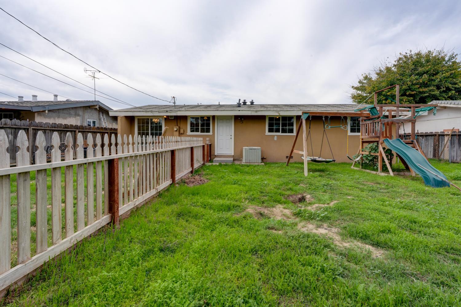 2310 Linden Street Atwater, CA 95301 - Photo 5 of 32 a view of a house with a yard and sitting area