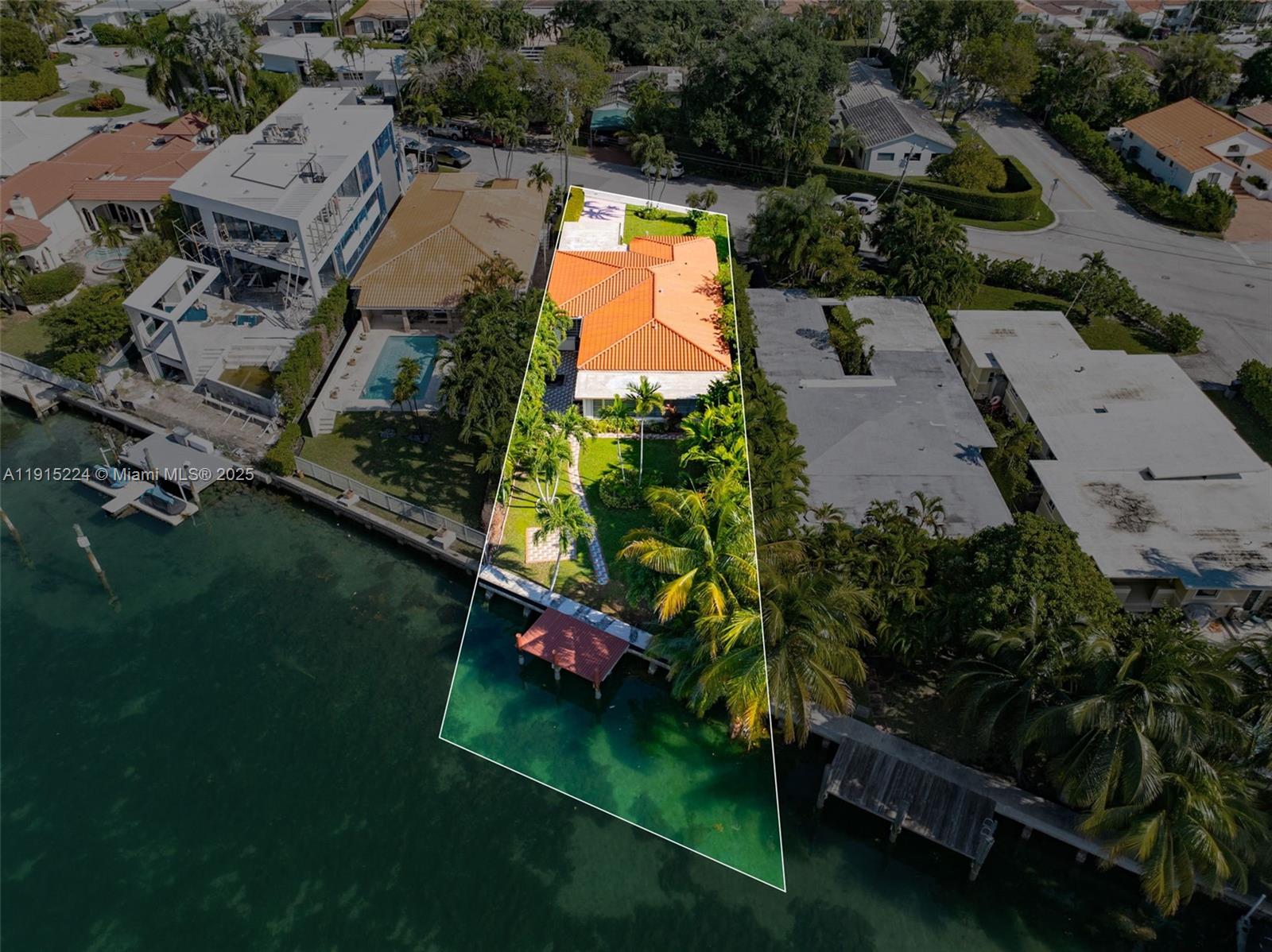 9316 Bay Drive Surfside, FL 33154 - Photo 2 of 8 an aerial view of residential houses with outdoor space and trees