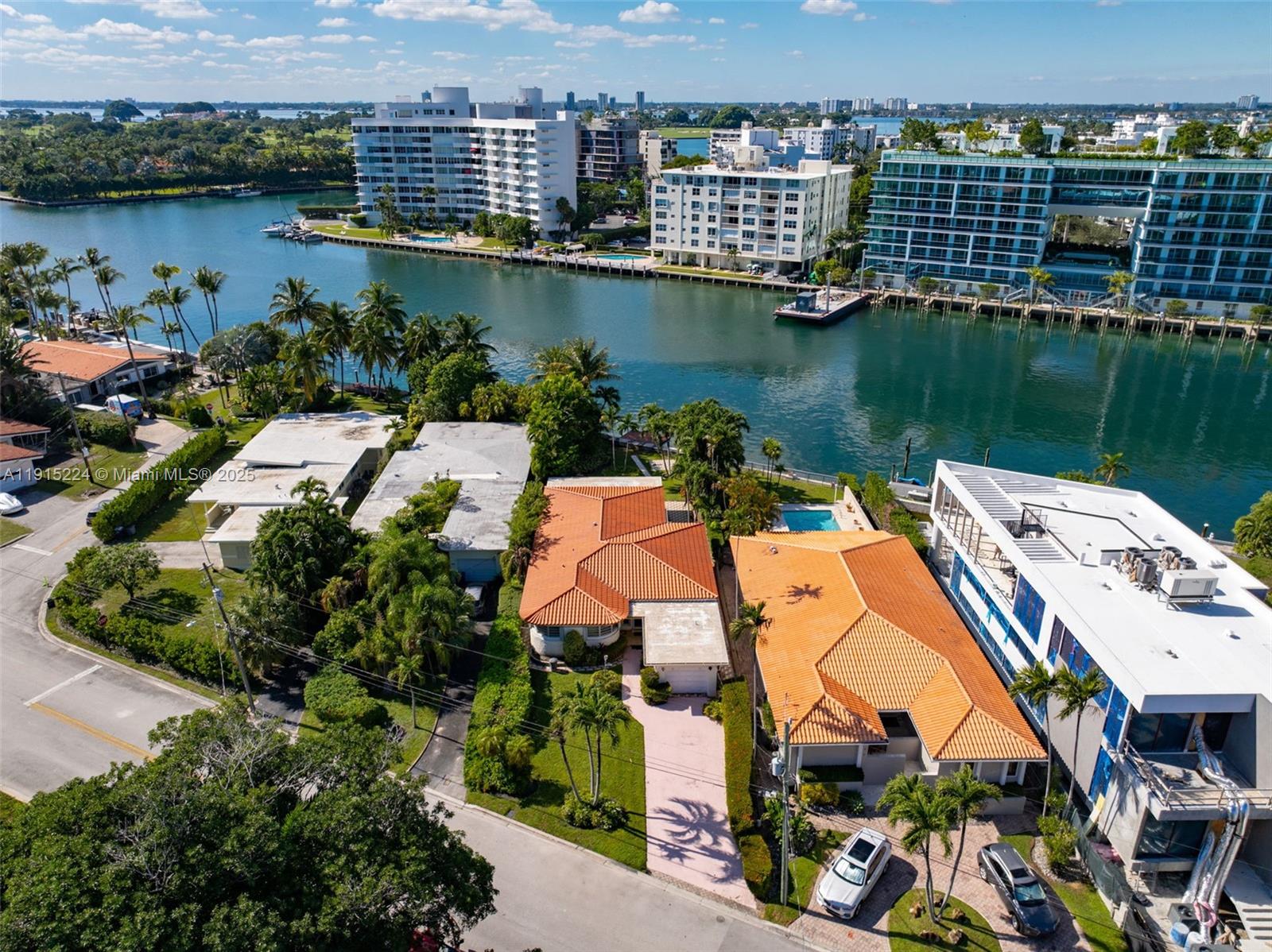 9316 Bay Drive Surfside, FL 33154 - Photo 8 of 8 an aerial view of a house with outdoor space and lake view