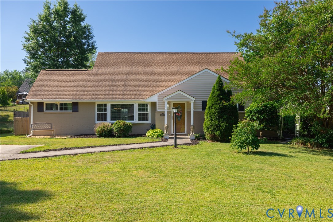 a view of a house with pool and yard