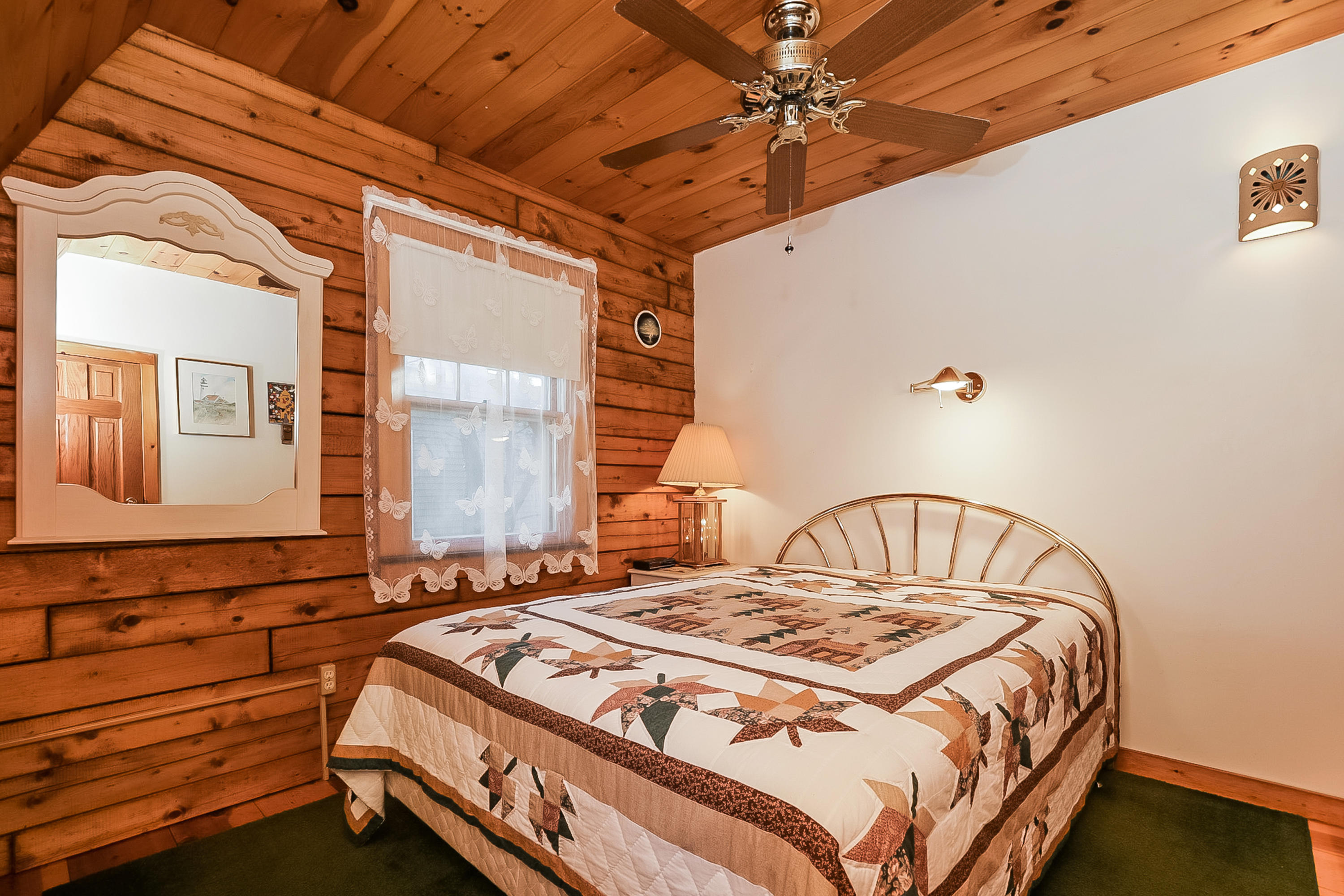 53 E Street Wellfleet, MA 02642 - Photo 24 of 41 a bedroom with a bed and a mirror