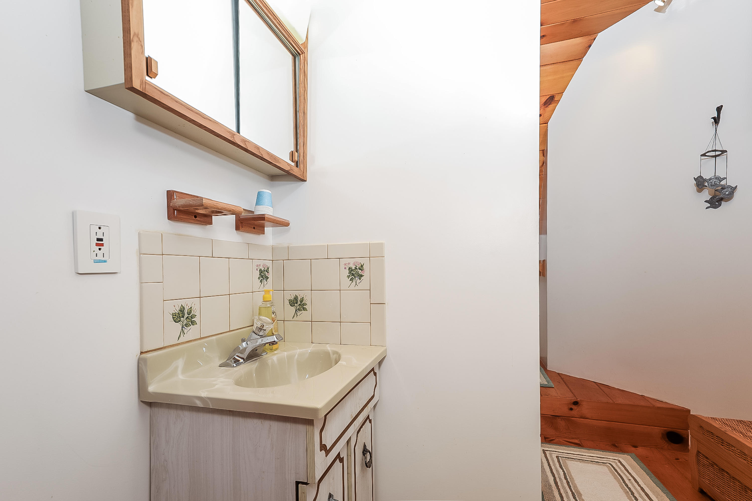 53 E Street Wellfleet, MA 02642 - Photo 25 of 41 a bathroom with a sink and a mirror