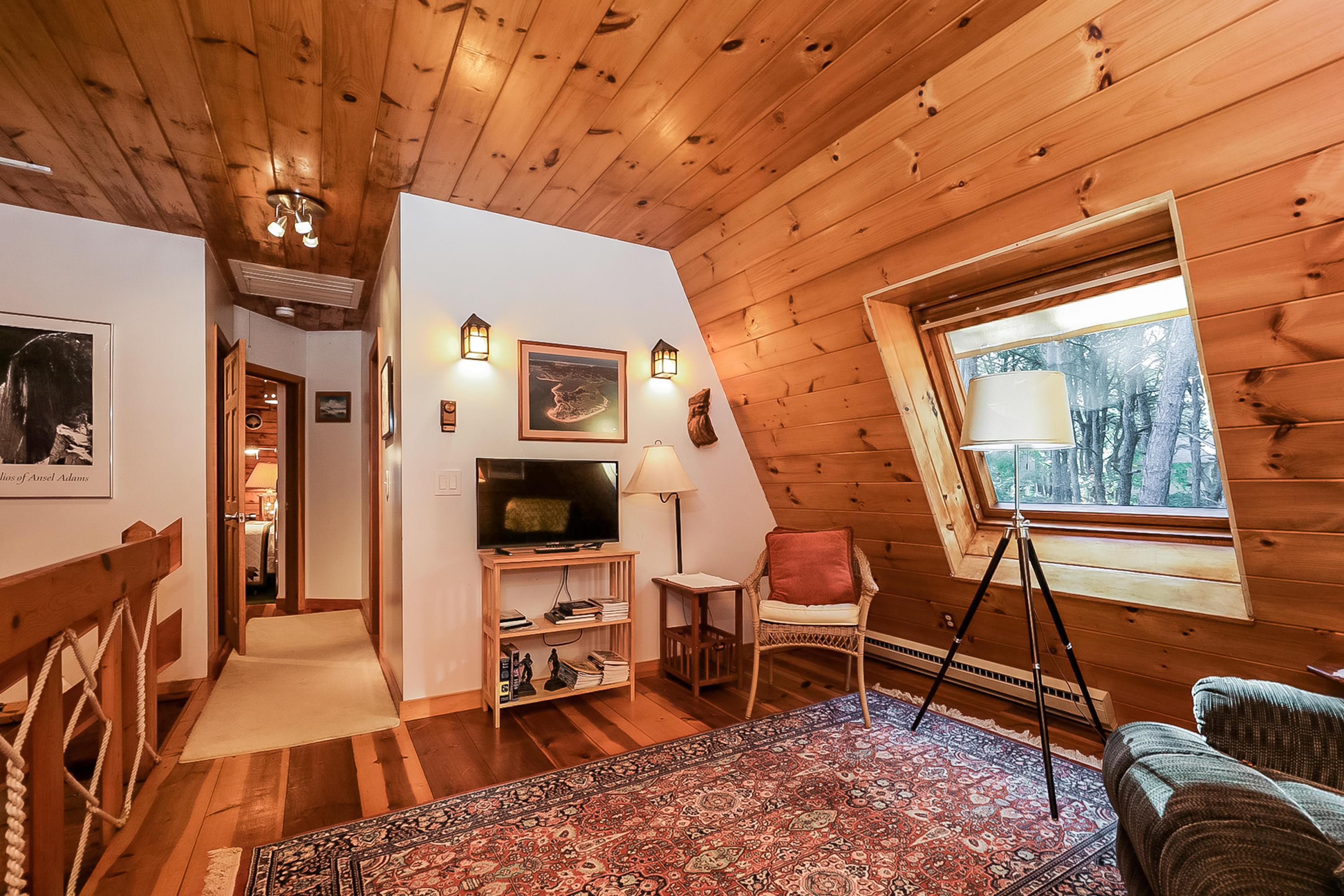 53 E Street Wellfleet, MA 02642 - Photo 29 of 41 a living room with patio furniture and a flat screen tv