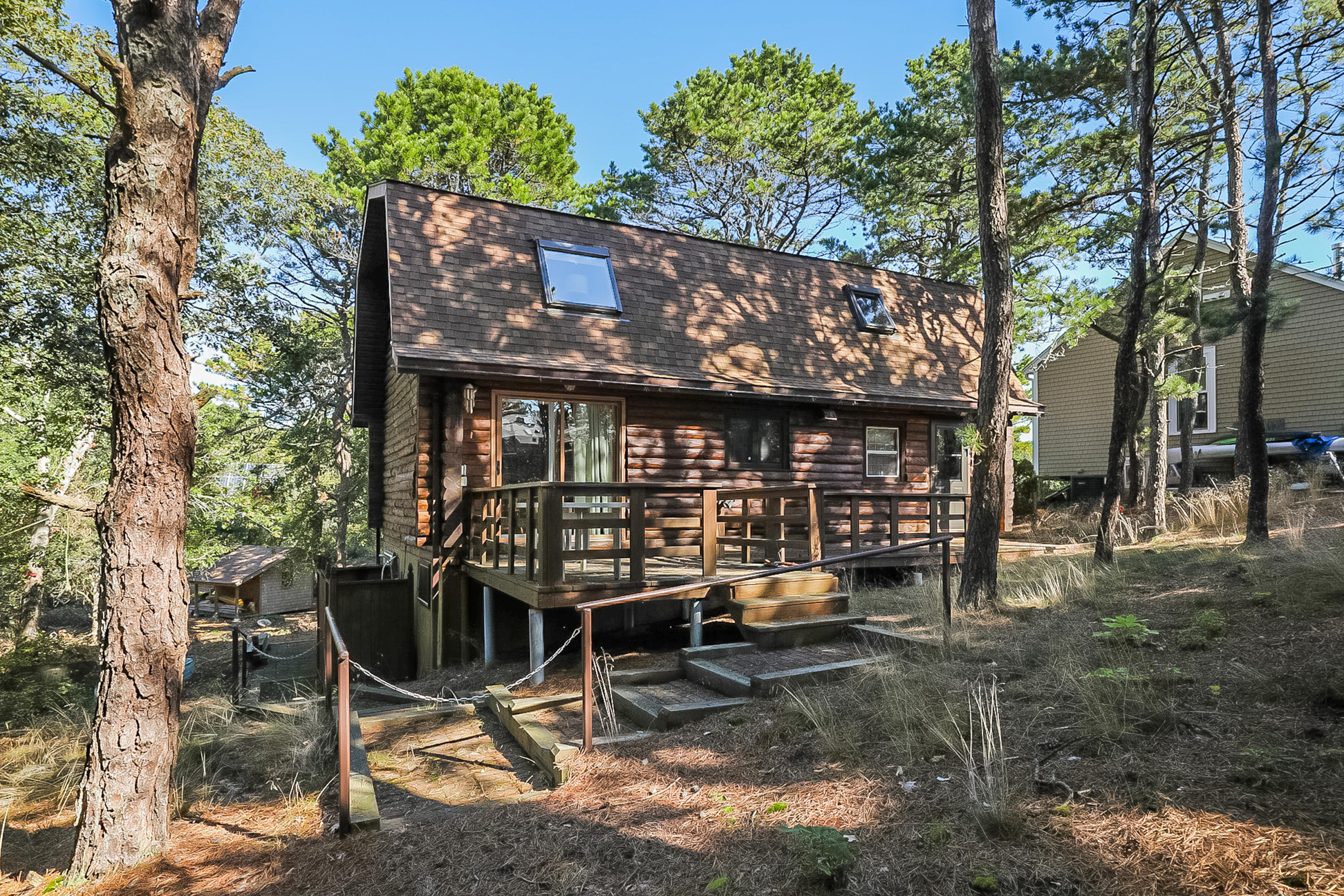 53 E Street Wellfleet, MA 02642 - Photo 3 of 41 a view of a chairs and table in the backyard