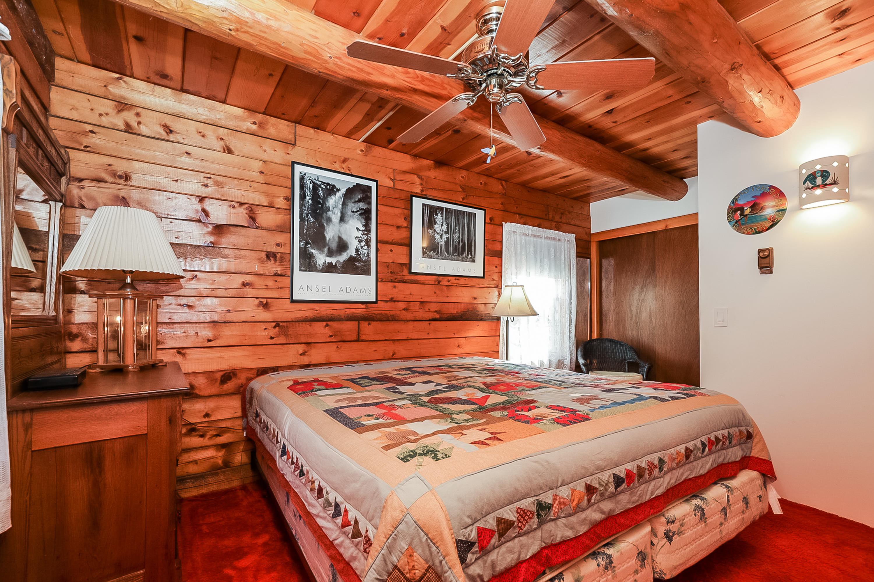 53 E Street Wellfleet, MA 02642 - Photo 31 of 41 a bedroom with a bed and a table with potted plant