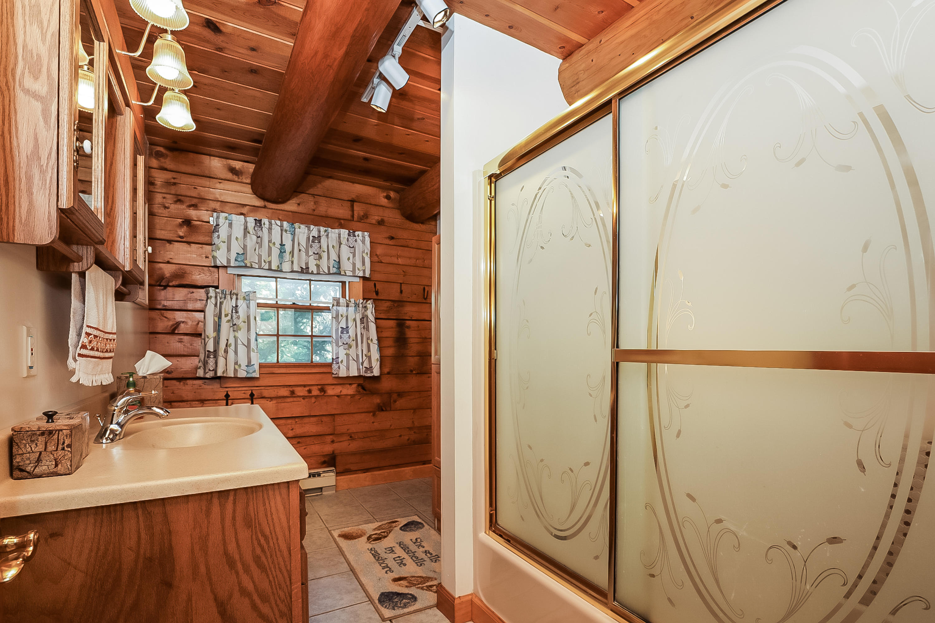 53 E Street Wellfleet, MA 02642 - Photo 32 of 41 a bathroom with a sink and a mirror