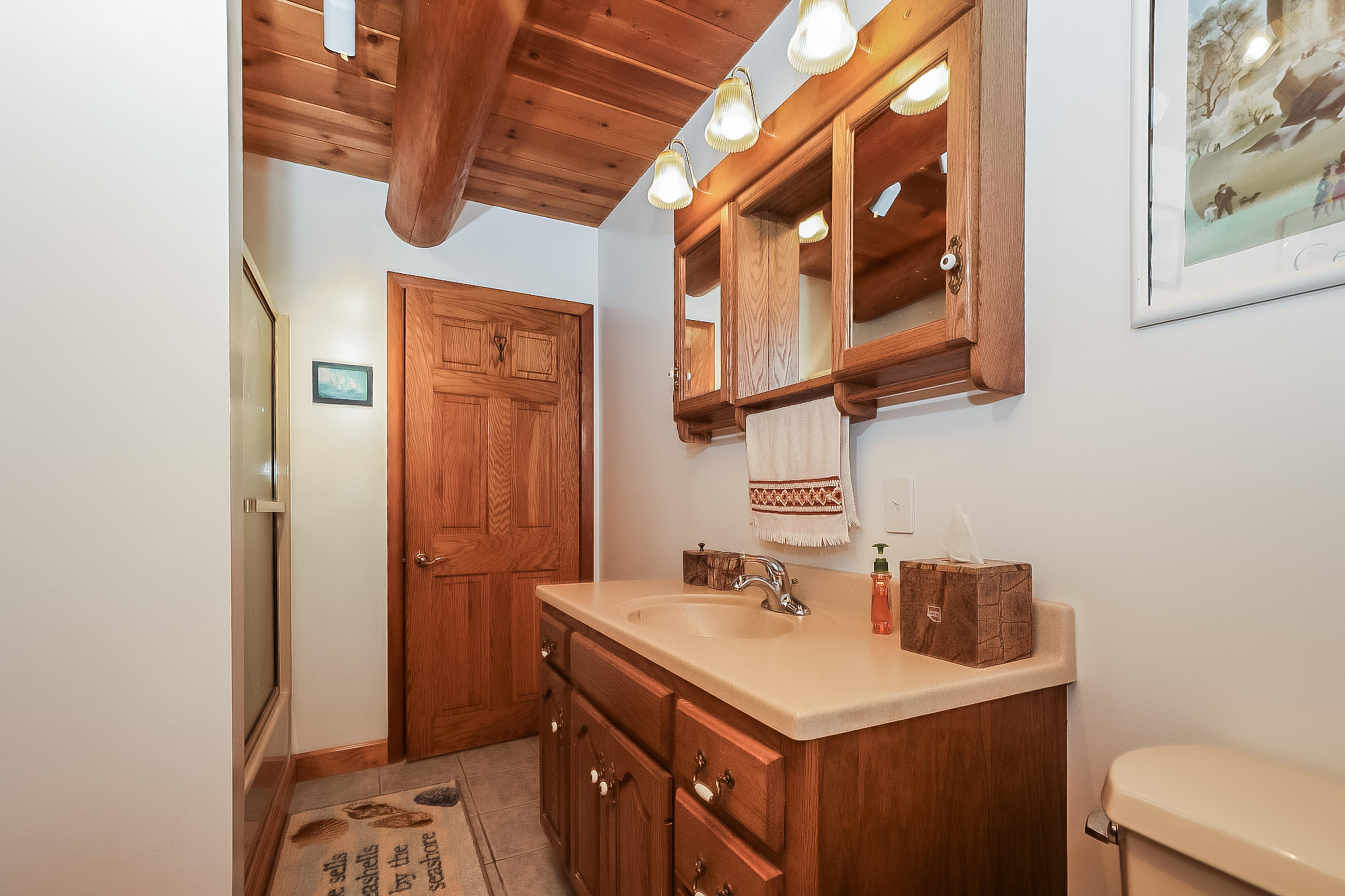 53 E Street Wellfleet, MA 02642 - Photo 33 of 41 a bathroom with a sink and a mirror