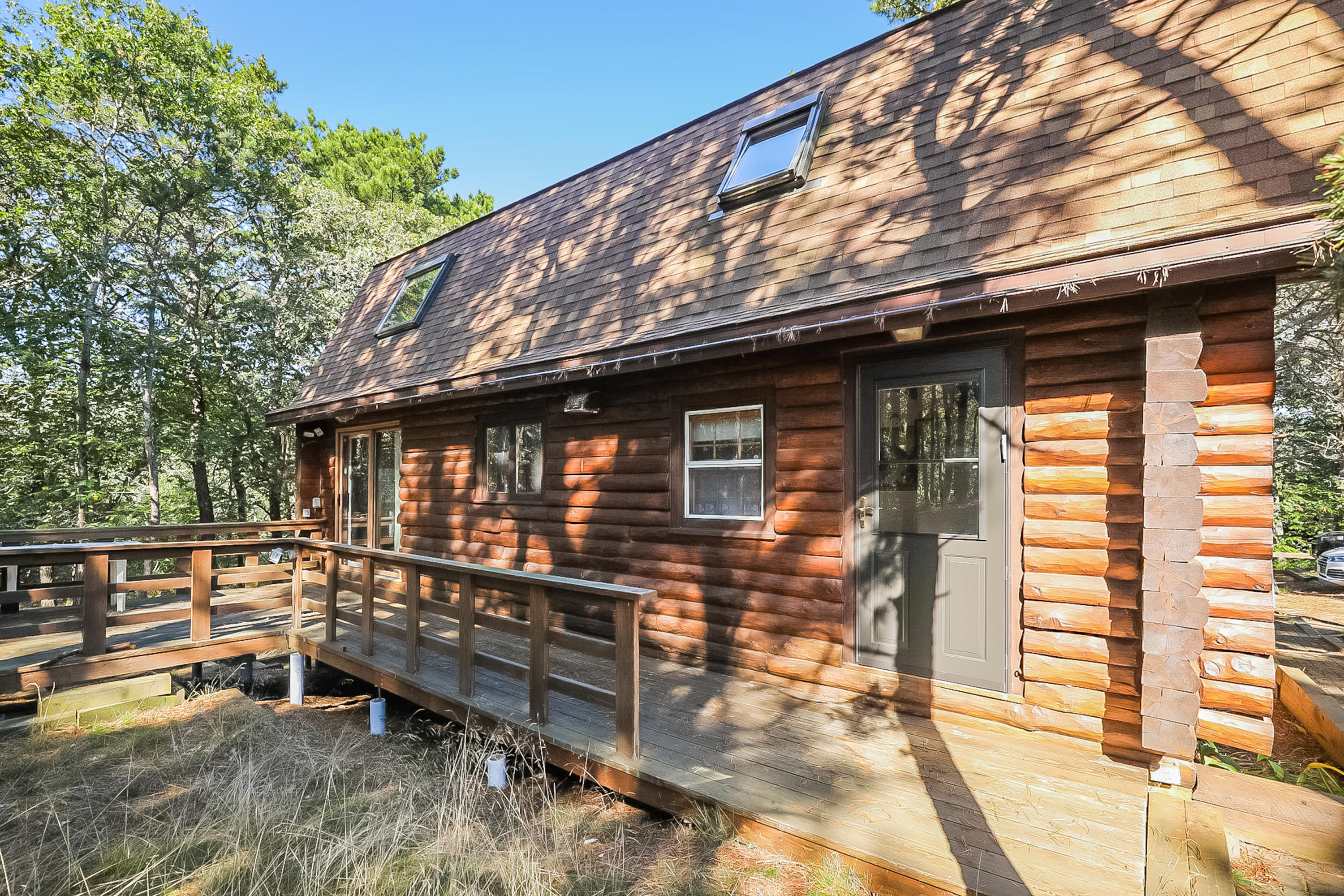 53 E Street Wellfleet, MA 02642 - Photo 40 of 41 a backyard of a house with table and chairs