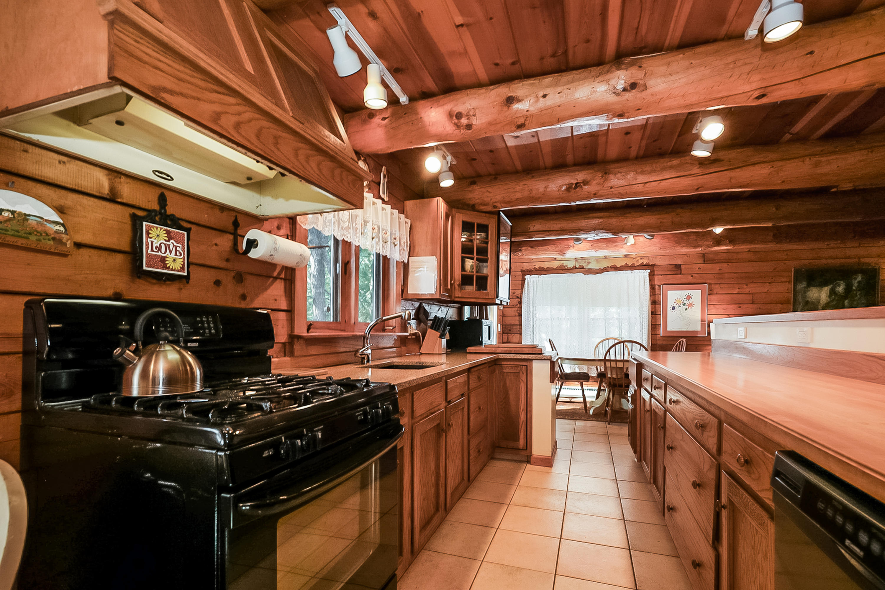 53 E Street Wellfleet, MA 02642 - Photo 8 of 41 a kitchen with a stove and a sink