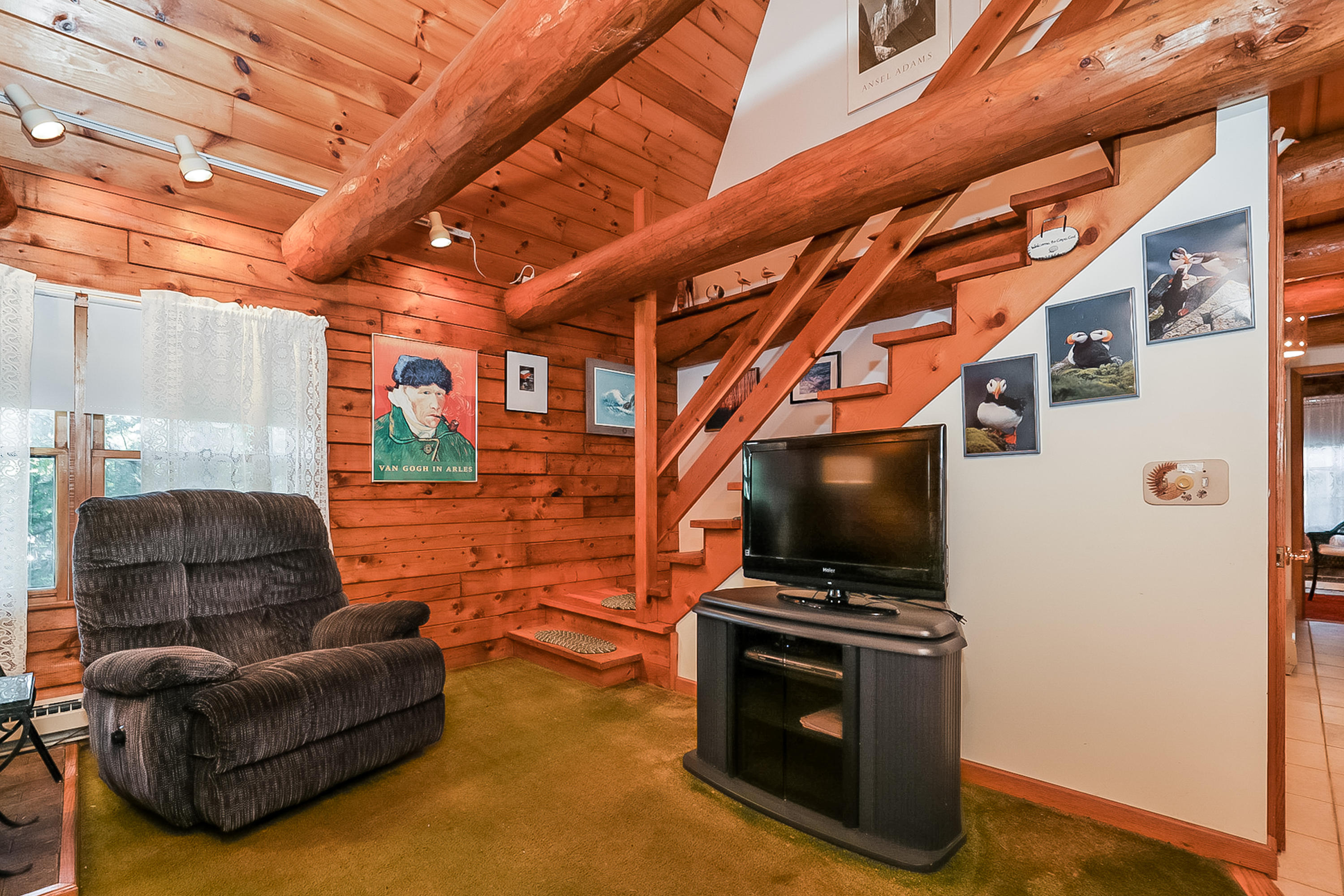 53 E Street Wellfleet, MA 02642 - Photo 10 of 41 a living room with furniture and a flat screen tv