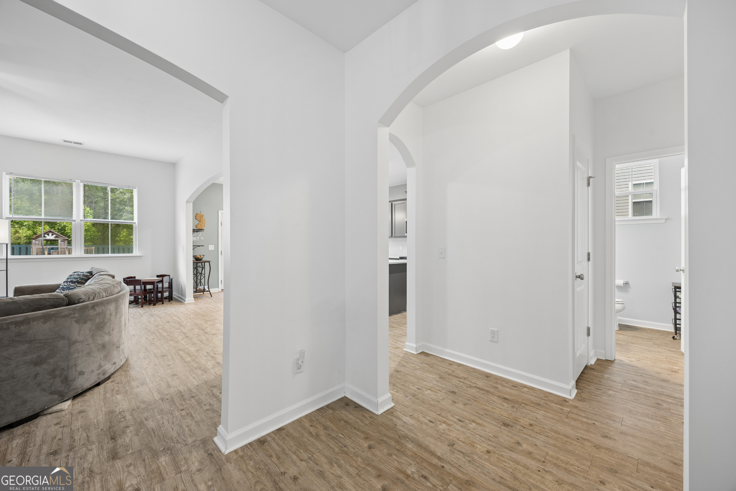 369 Waybridge Way Richmond Hill, GA 31324 - Photo 27 of 40 a view of a livingroom with wooden floor and furniture