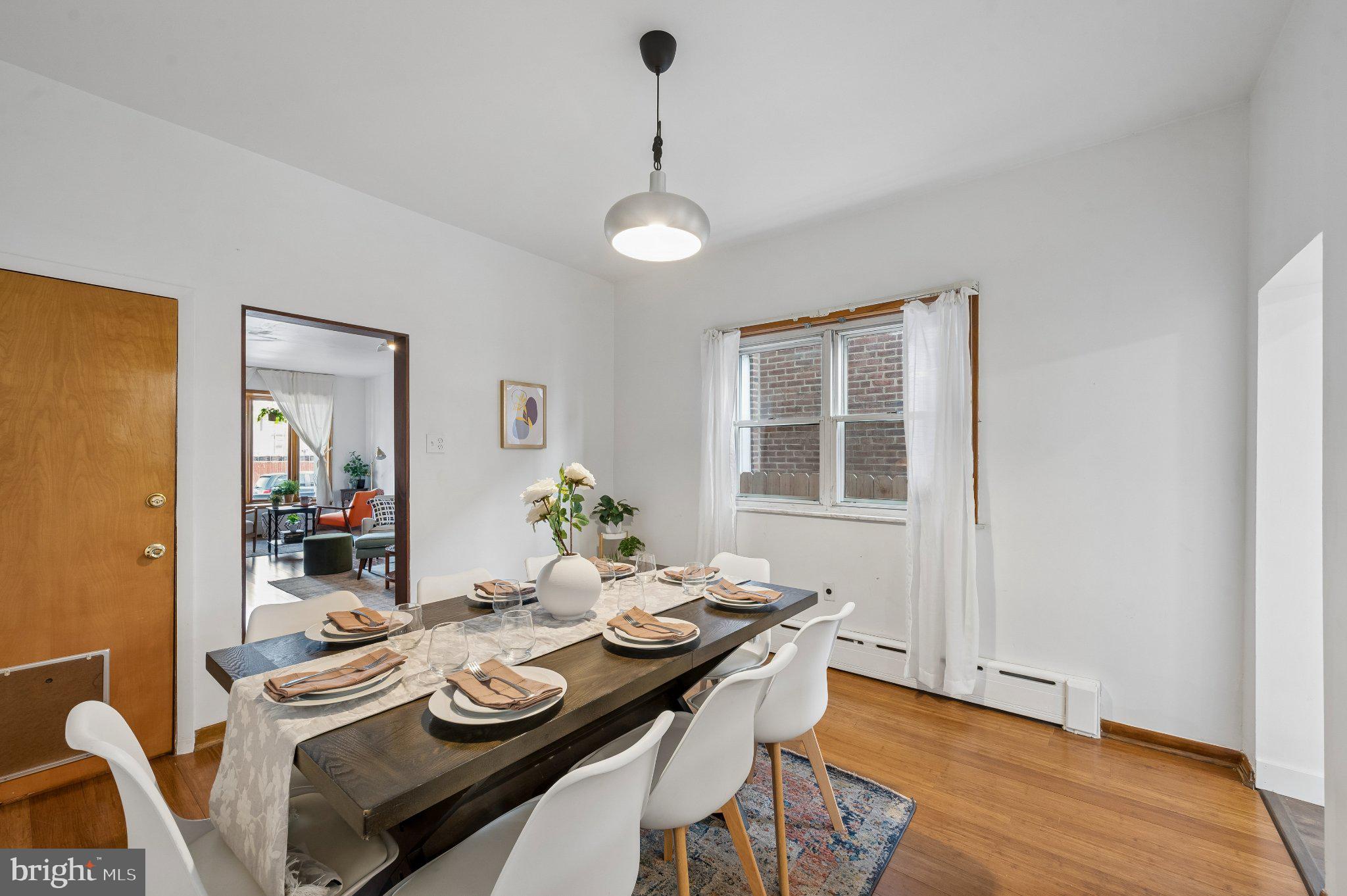 3346 Edgemont Street Philadelphia, PA 19134 - Photo 11 of 25 a view of a dining room with furniture window and wooden floor