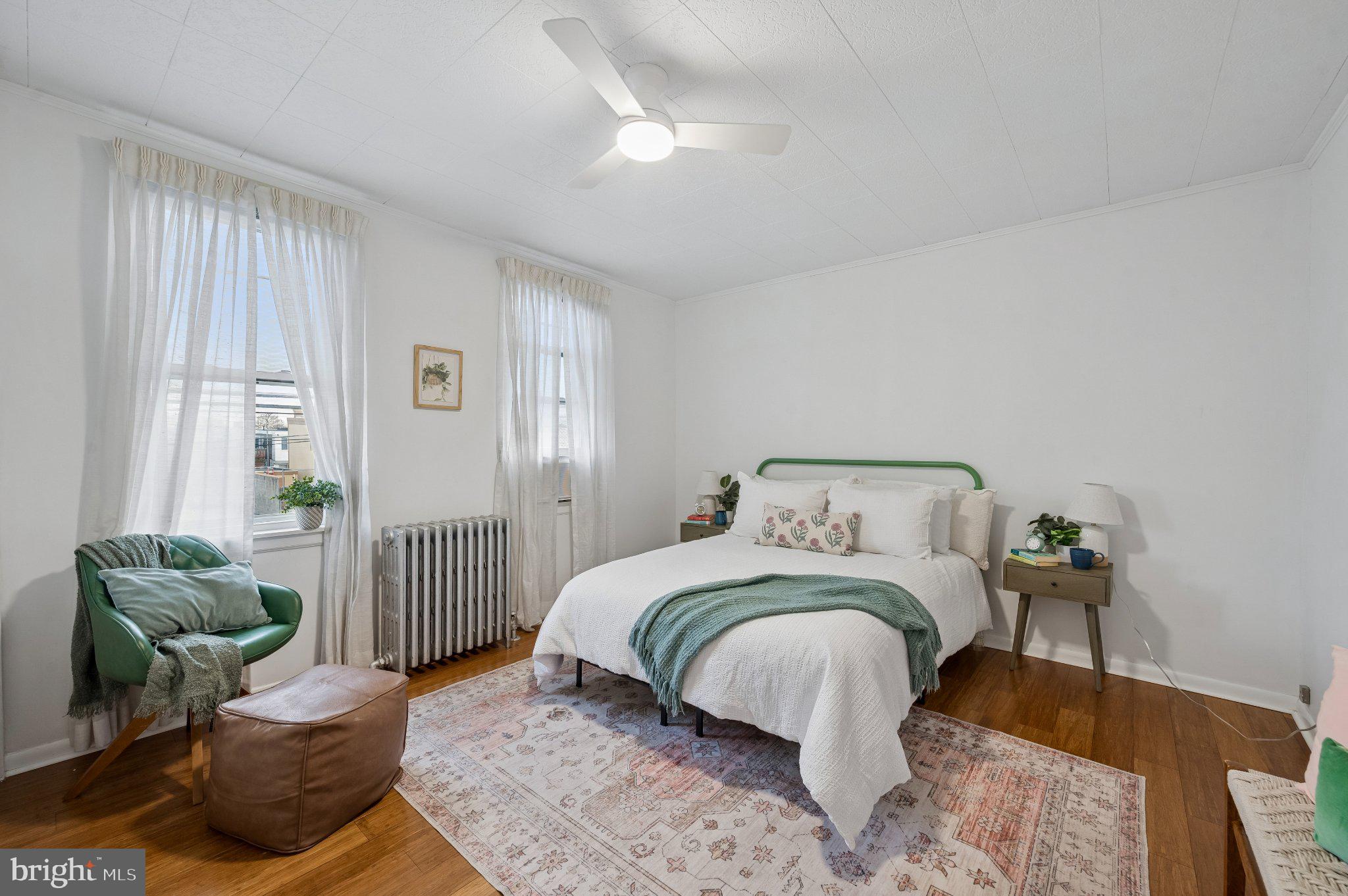 3346 Edgemont Street Philadelphia, PA 19134 - Photo 16 of 25 a bedroom with a bed and a couch