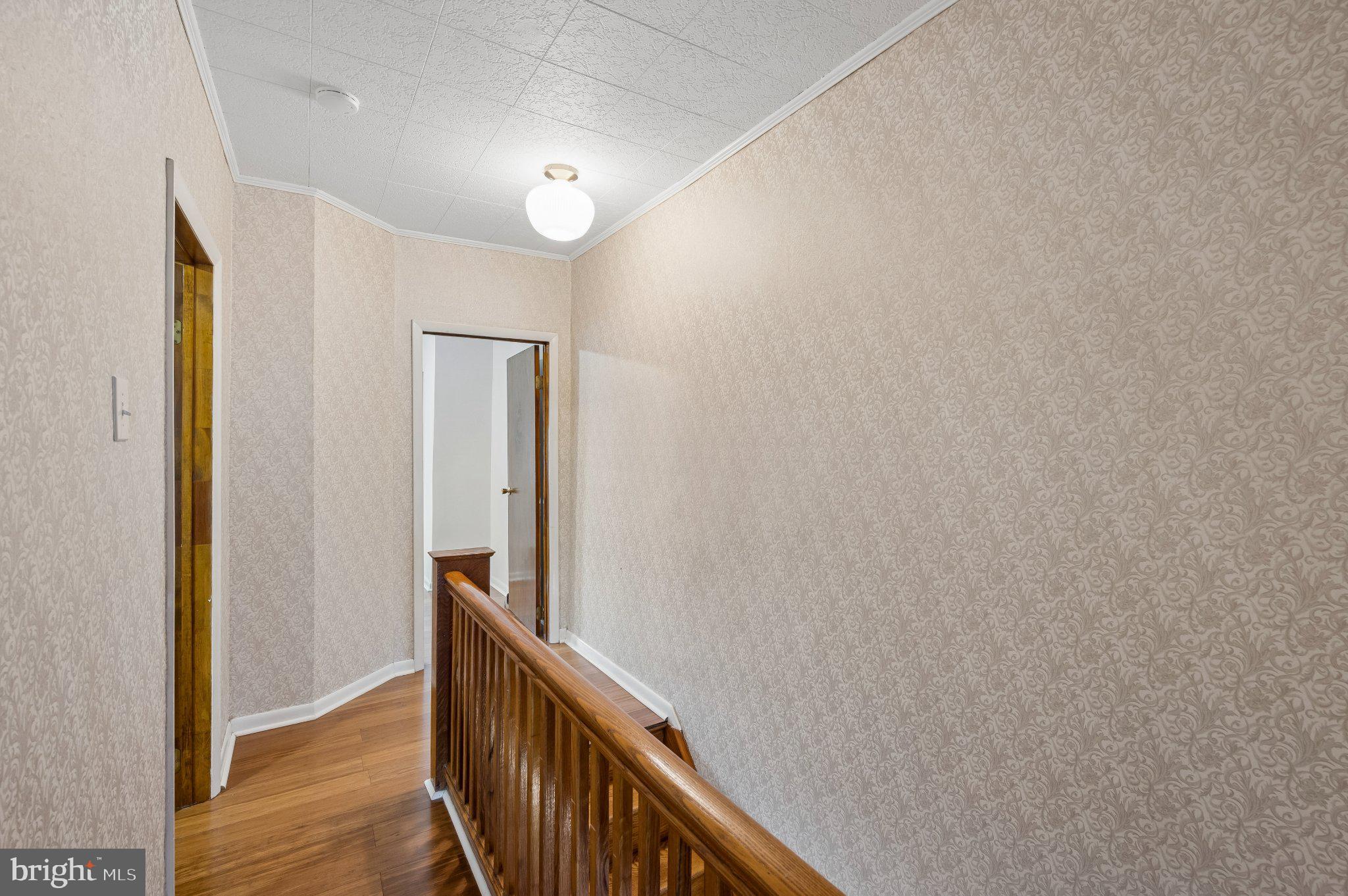 3346 Edgemont Street Philadelphia, PA 19134 - Photo 21 of 25 a view of a hallway with wooden floor and staircase