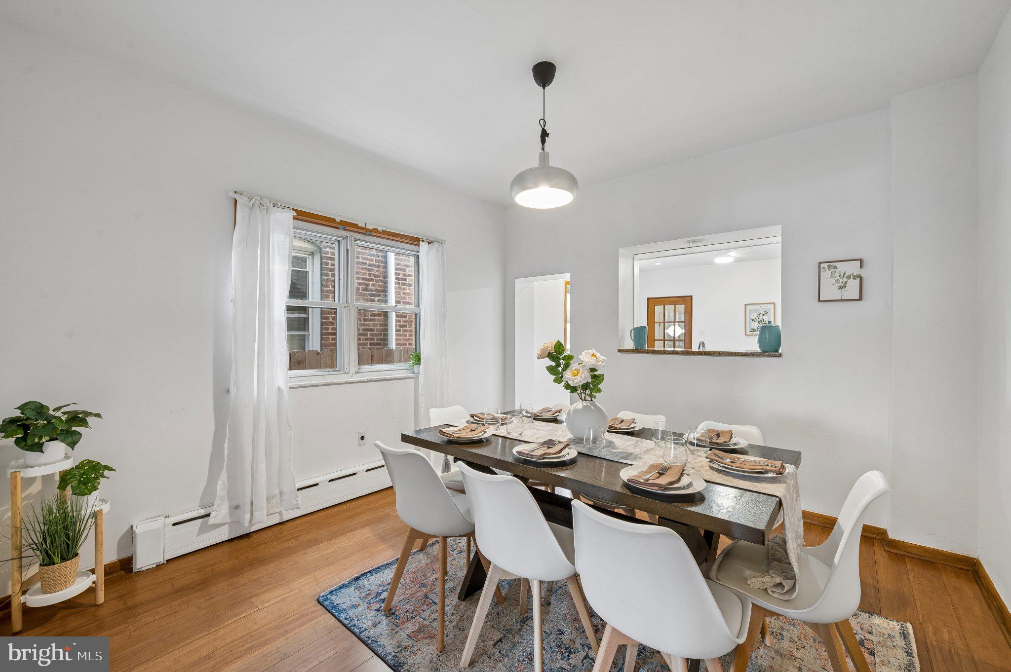 3346 Edgemont Street Philadelphia, PA 19134 - Photo 9 of 25 a view of a dining room with furniture window and wooden floor