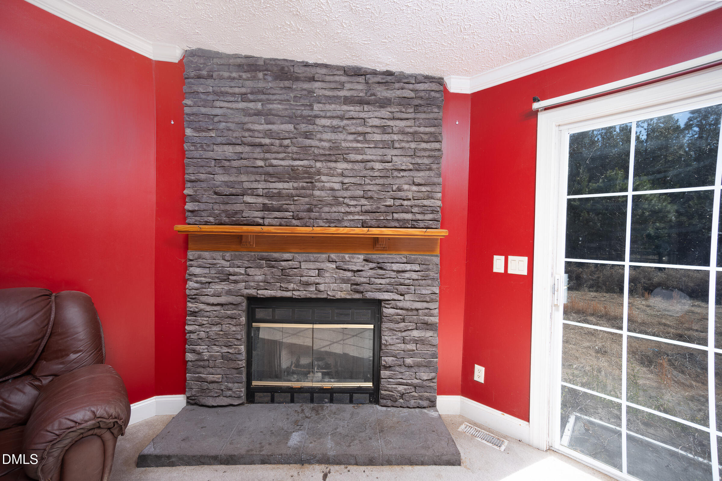 240 Clarence Alston Road Franklinton, NC 27525 - Photo 7 of 8 a living room with furniture a fireplace and a table