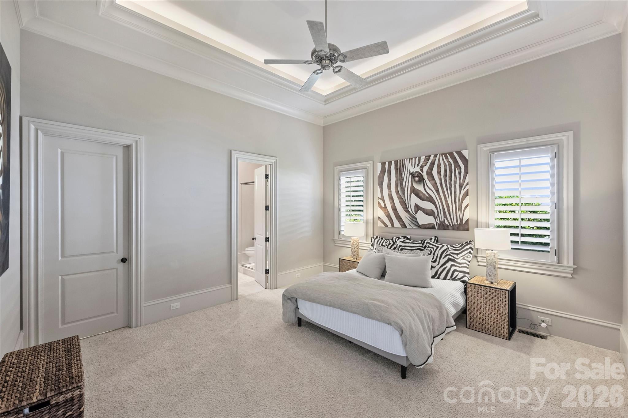 18394 Nantz Road Cornelius, NC 28031 - Photo 24 of 47 a bedroom with a bed and a chandelier