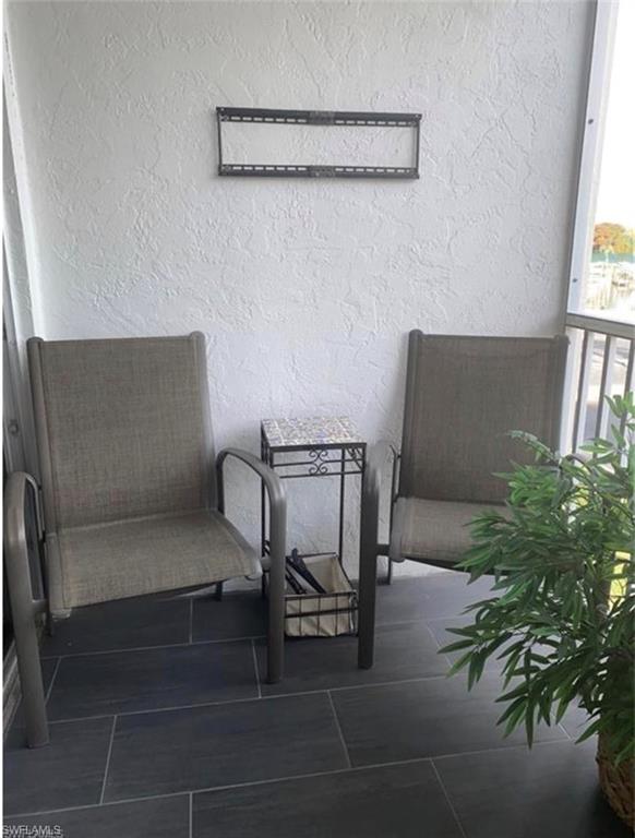 3 Bluebill Avenue, Unit 211 Naples, FL 34108 - Photo 2 of 8 a view of entryway with livingroom