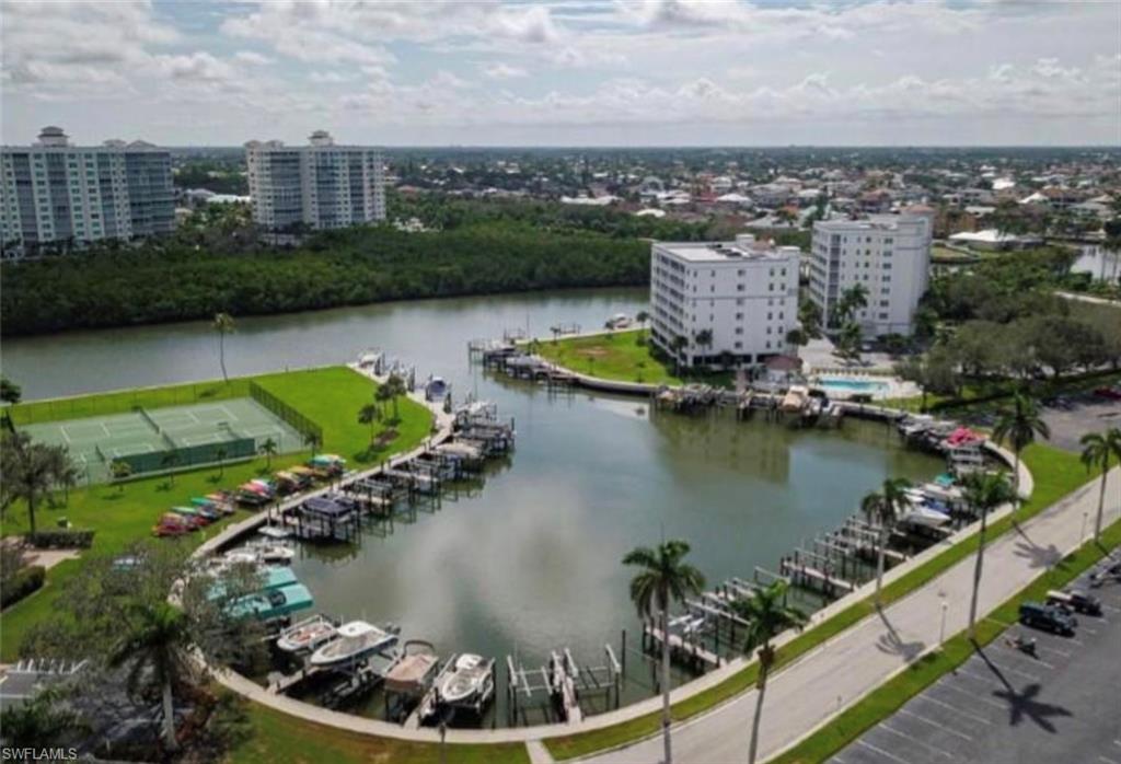 3 Bluebill Avenue, Unit 211 Naples, FL 34108 - Photo 7 of 8 an aerial view of a house with a lake view