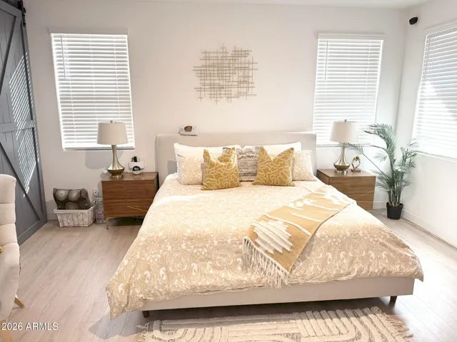 a bedroom with bed and window