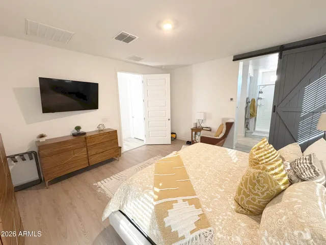 a bed room with television and a bed