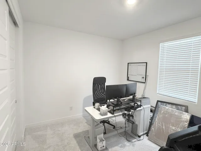 a view of a workspace with furniture