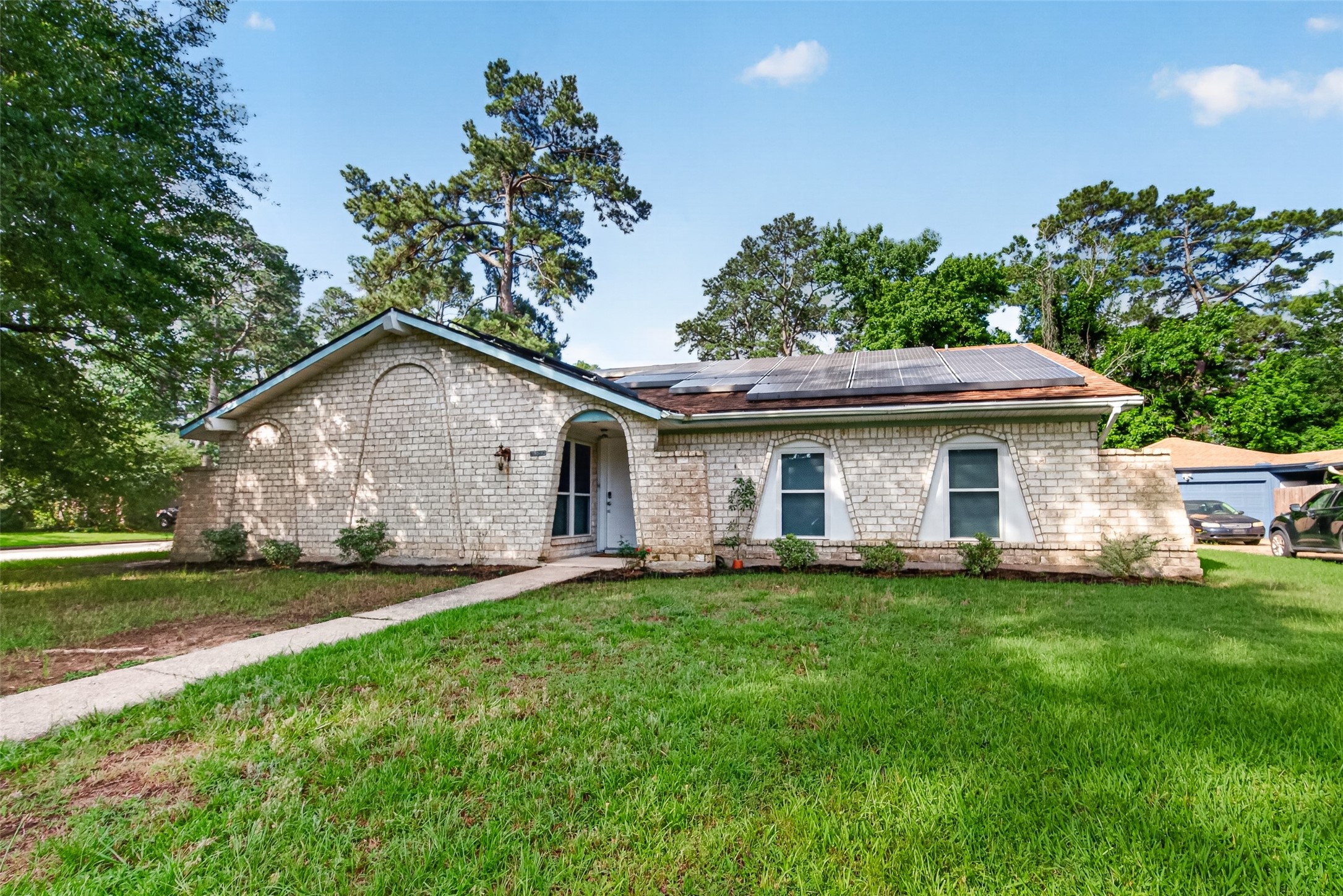 25503 Foxbriar Lane Spring, TX 77373 - Photo 41 of 45 a front view of a house with a garden and trees