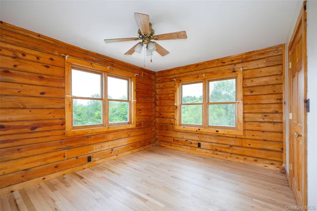 a bedroom with a large bed and a large window