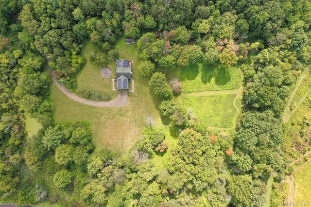 a bathroom with a small yard and green space