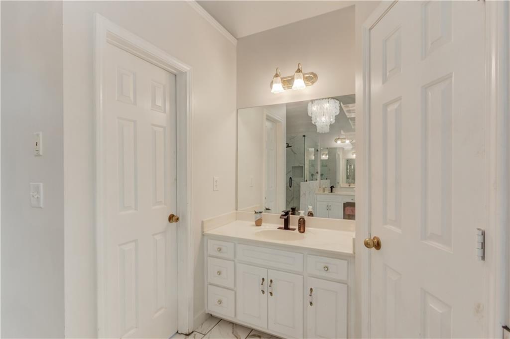 2310 Olde Hickory Place Monroe, GA 30656 - Photo 22 of 46 a bathroom with a sink vanity and a mirror