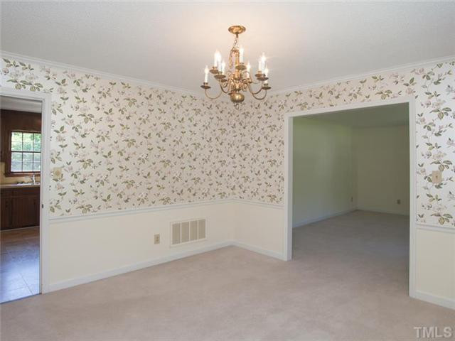 6109 Dodsworth Drive Raleigh, NC 27612 - Photo 4 of 21 Formal dining room with chair rail.