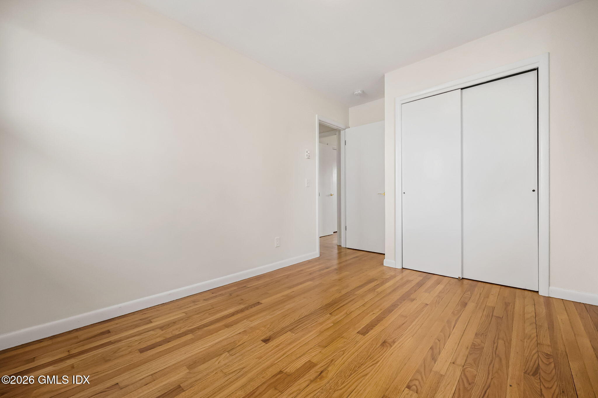 2 Grange Street Greenwich, CT 06830 - Photo 26 of 31 a view of an empty room with wooden floor