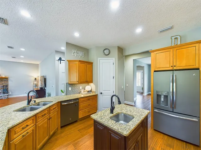 a view of a park with large trees