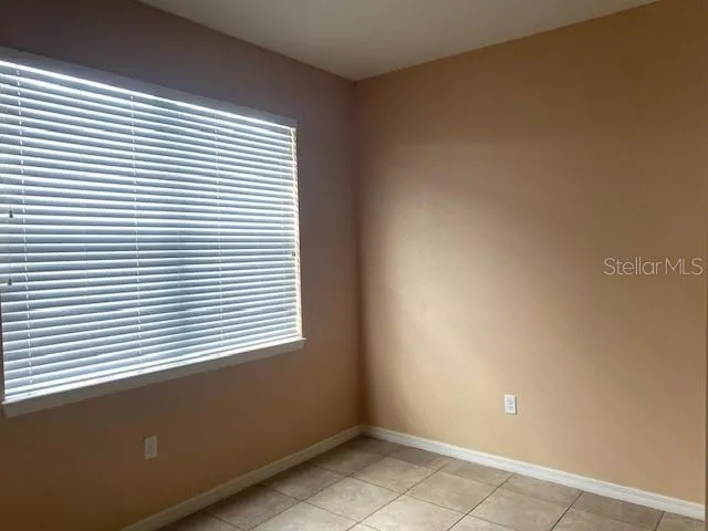 a view of a room that has a window in it