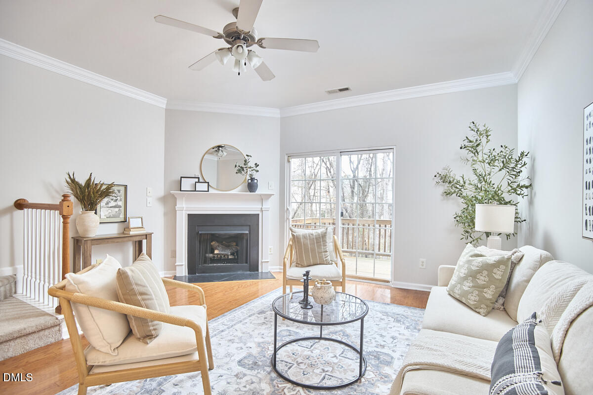 638 Cupola Drive Raleigh, NC 27603 - Photo 13 of 43 a living room with furniture a fireplace and a potted plant