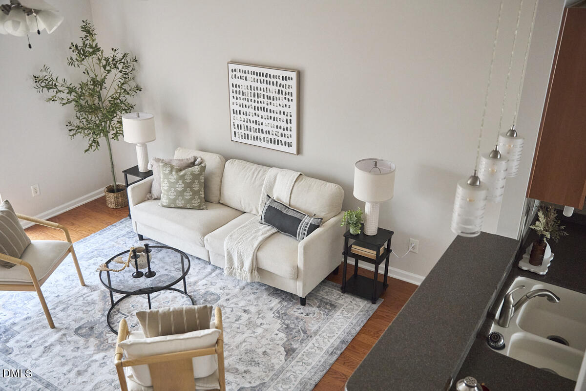 638 Cupola Drive Raleigh, NC 27603 - Photo 22 of 43 a living room with furniture and a potted plant