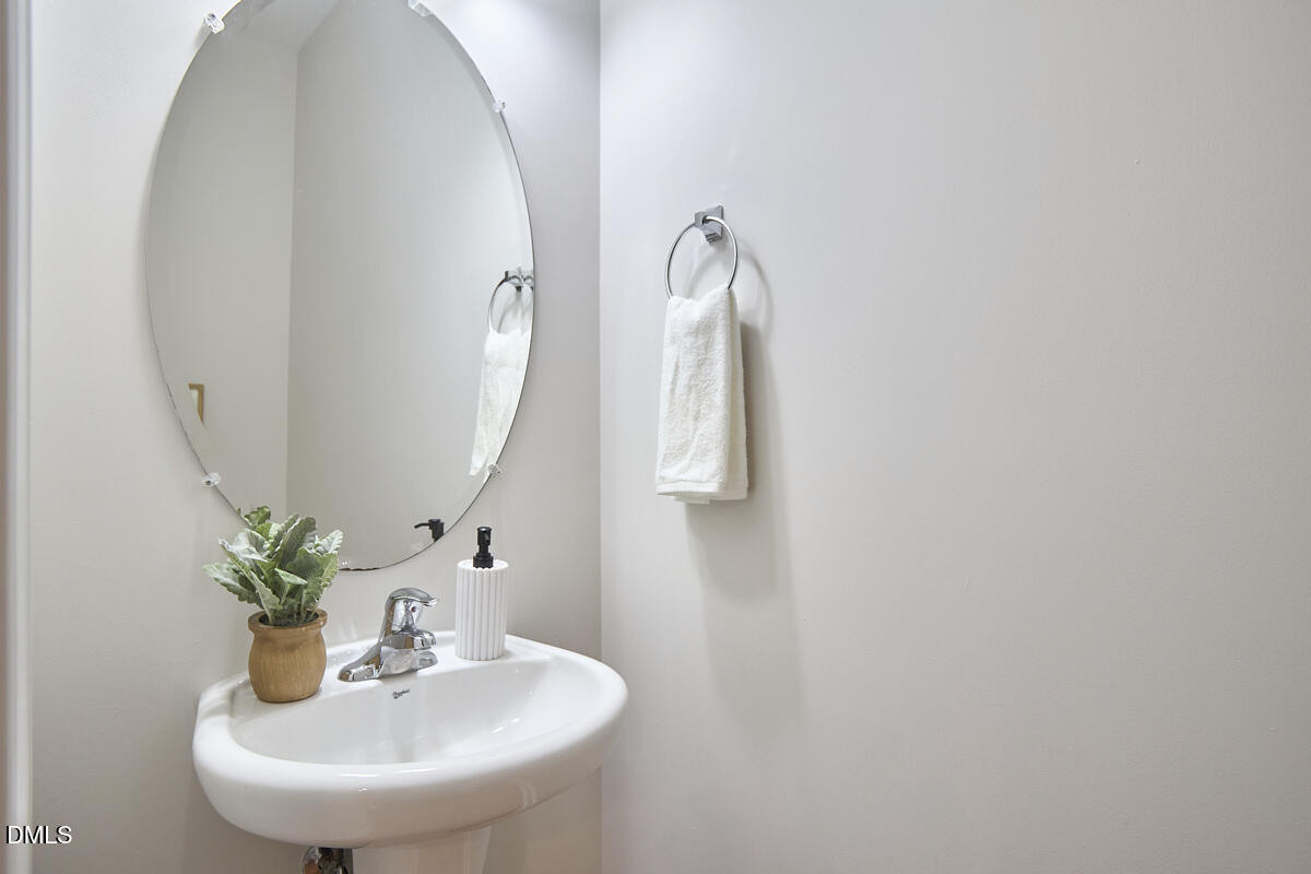 638 Cupola Drive Raleigh, NC 27603 - Photo 24 of 43 a bathroom with a sink and a mirror