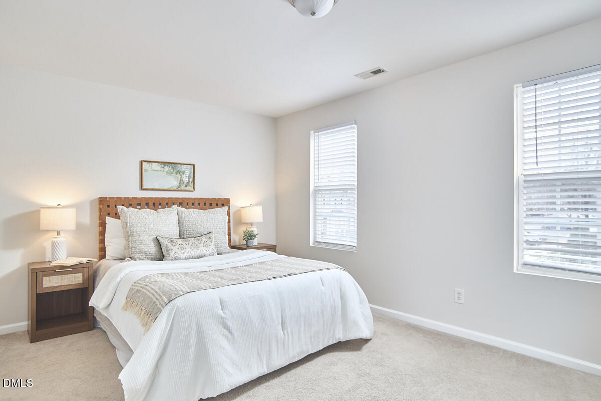 638 Cupola Drive Raleigh, NC 27603 - Photo 25 of 43 a bedroom with a bed and a window