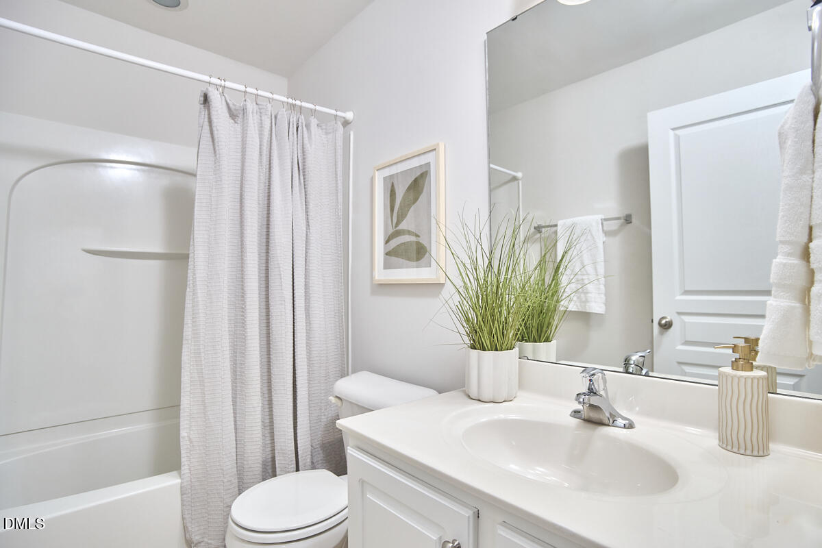 638 Cupola Drive Raleigh, NC 27603 - Photo 26 of 43 a bathroom with a sink toilet and shower