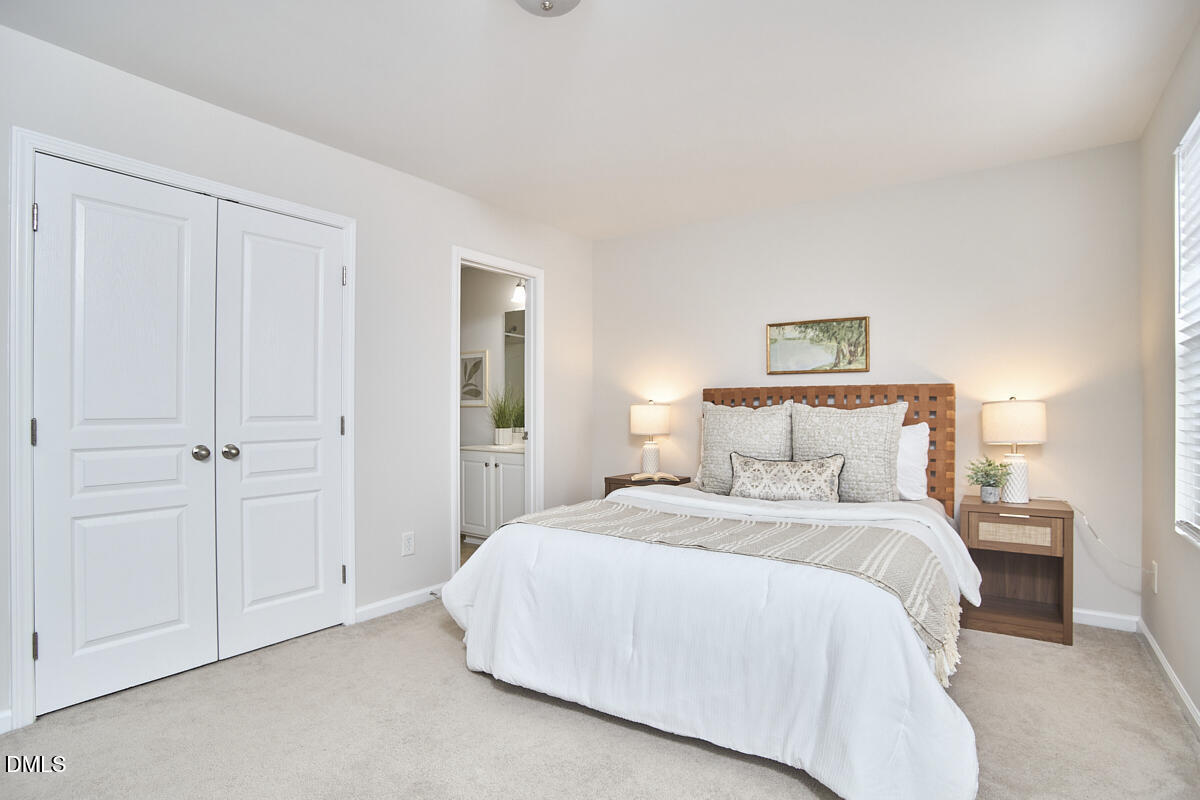 638 Cupola Drive Raleigh, NC 27603 - Photo 27 of 43 a bedroom with a bed and a night lamp