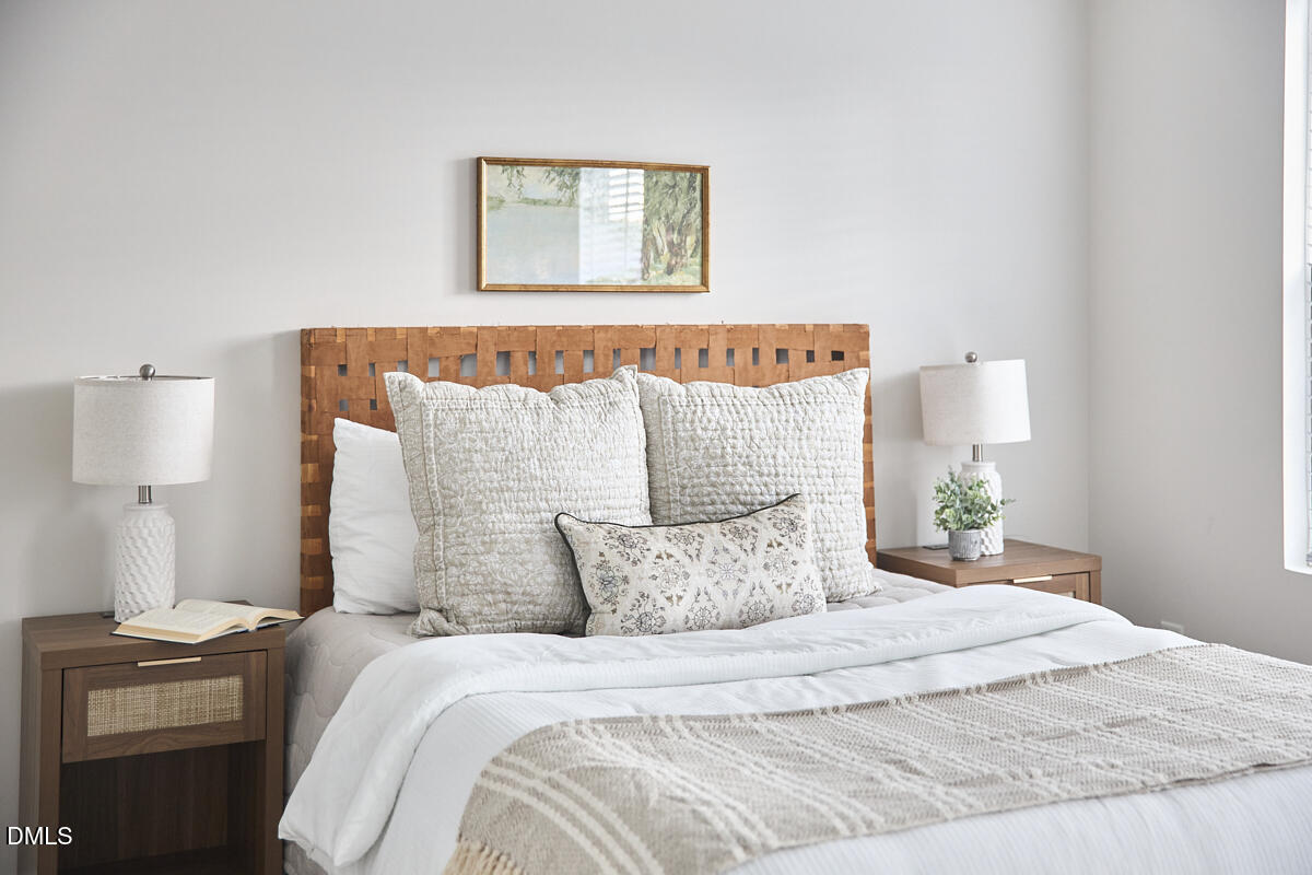 638 Cupola Drive Raleigh, NC 27603 - Photo 28 of 43 a bedroom with a bed and a lamp