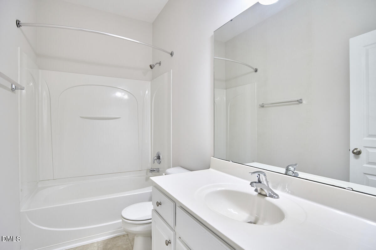 638 Cupola Drive Raleigh, NC 27603 - Photo 30 of 43 a bathroom with a sink toilet and shower