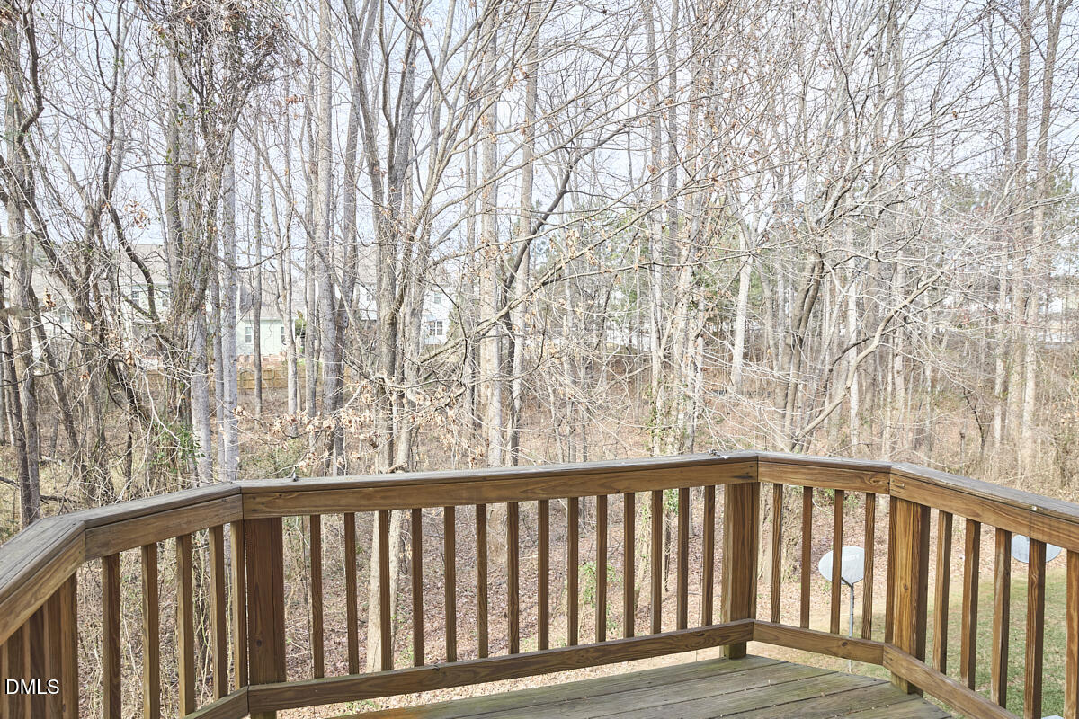 638 Cupola Drive Raleigh, NC 27603 - Photo 42 of 43 a balcony with wooden floor and fence