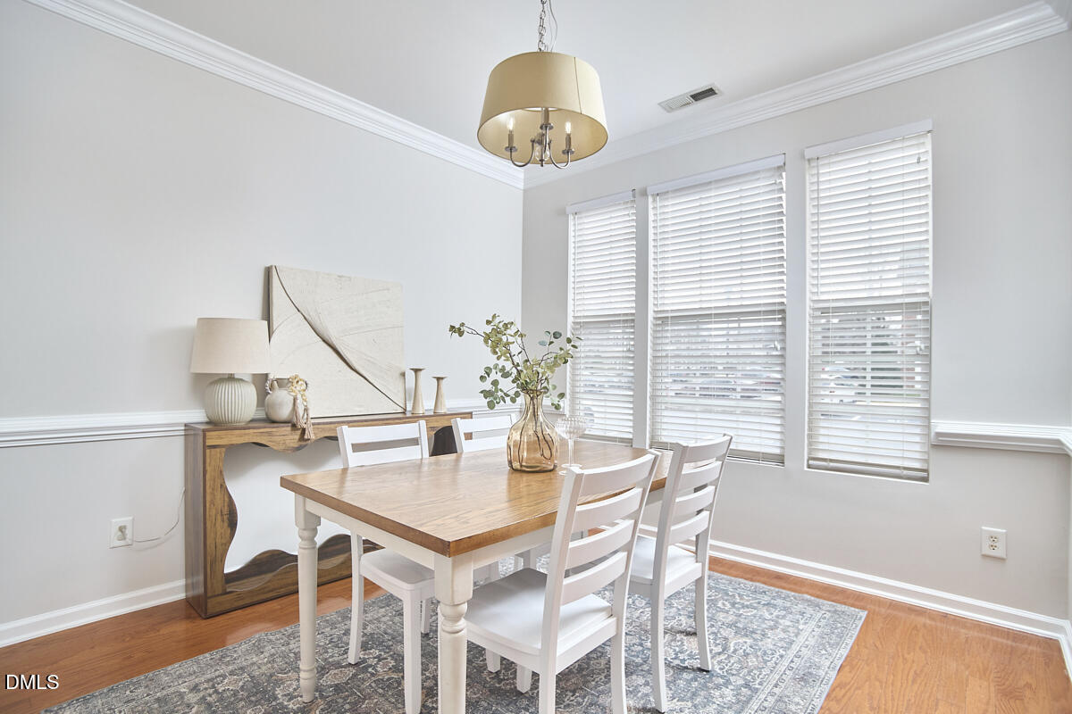 638 Cupola Drive Raleigh, NC 27603 - Photo 5 of 43 a dining room with furniture and window